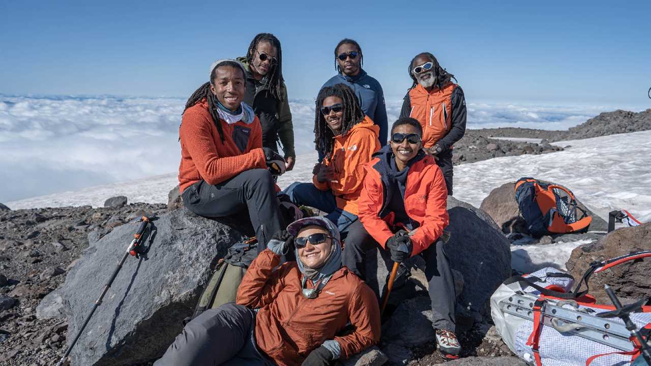 Mountaineer Philip Henderson and climbing team on the summit of Washington's Mount Rainier.