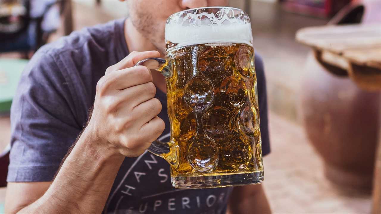 man drinking a beer at oktoberfest