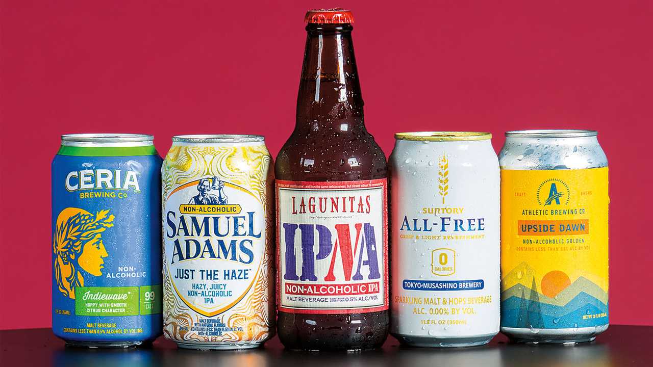 Lineup of nonalcoholic beers. From left: Ceria Brewing Company Grainwave, Samuel Adams Just the Haze IPA, Lagunitas Brewing Company IPNA, Suntory All-Free, and Athletic Brewing Company Upside Dawn Golden Ale