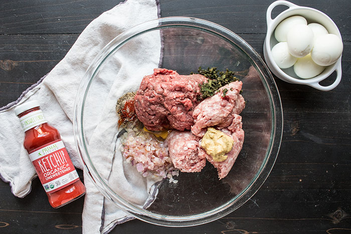 meat and spices in a bowl for mini meatloaf scotch eggs recipe