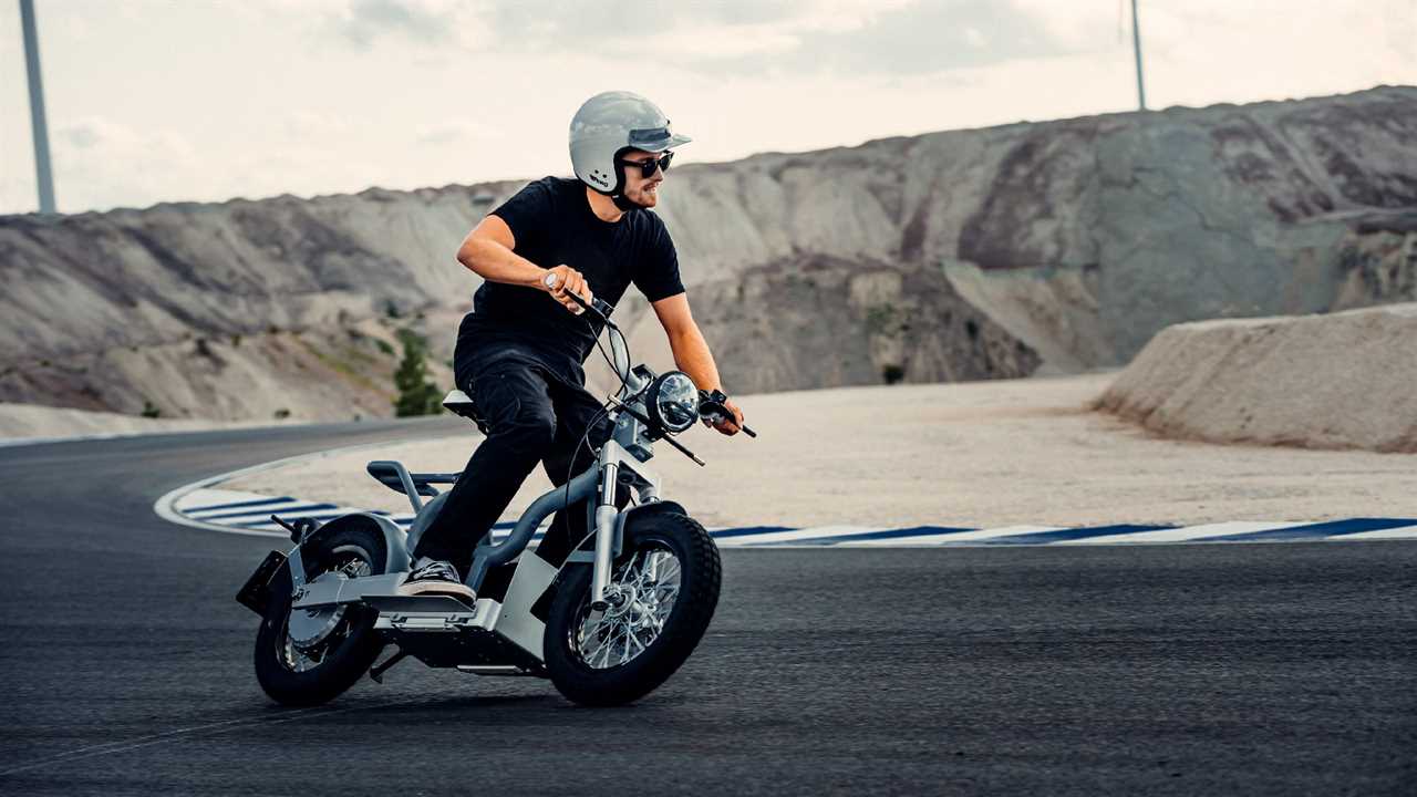 Man riding hybrid e-bike with helmet