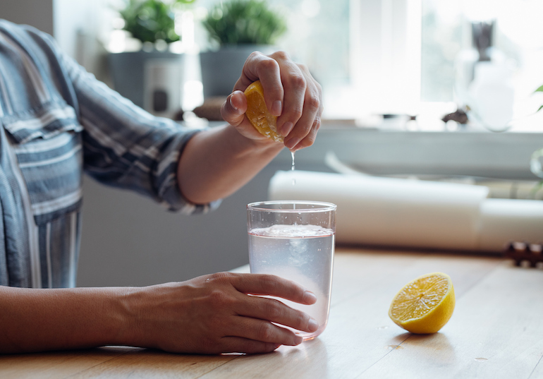woman making lemon water