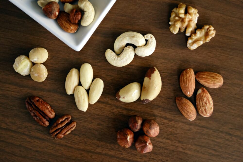 assorted nuts on a table containing omega-3 and omega-6 fats