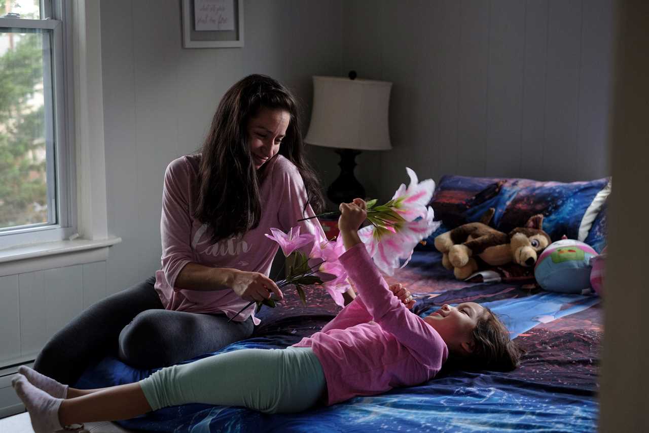 Mia shares a moment with her mother, Diana. Waldick, New Jersey, 2021 Â© Sean Sirota for Time Magazine