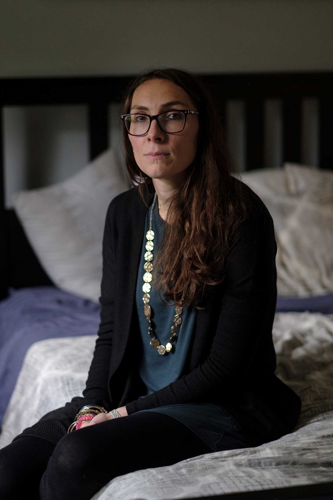 Pamela Addison poses for a portrait in her bedroom. Pamela lost her husband, Martin Addison, to COVID-19. Waldick, New Jersey, 2021 Â© Sean Sirota for Time Magazine