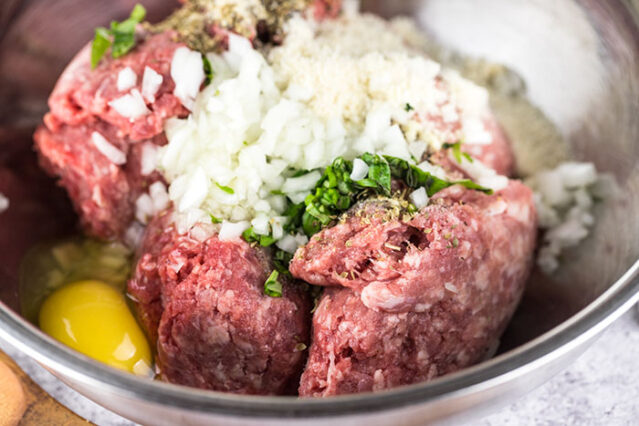 meatball ingredients in a bowl for gluten-free spicy meatballs