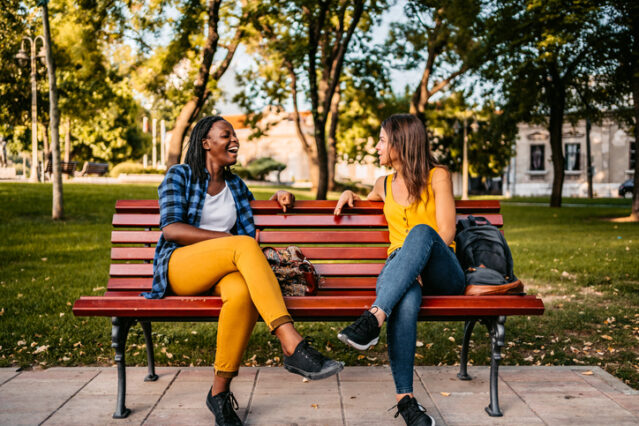 women talking about the primal lifestyle on a park bench