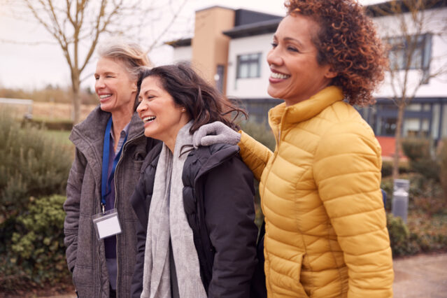 group of women walking at work storytelling