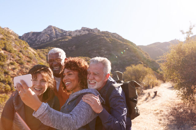 senior friends hiking because friendships lead to longevity