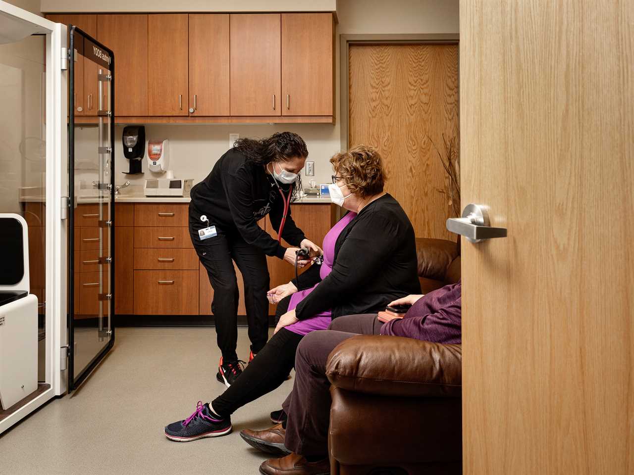 Amber Rauschâ€™s blood pressure is taken during Long COVID testing