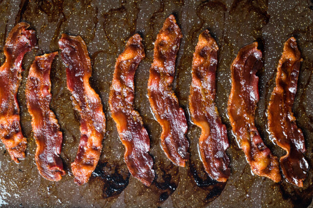 Crispy bacon in a roasting pan.