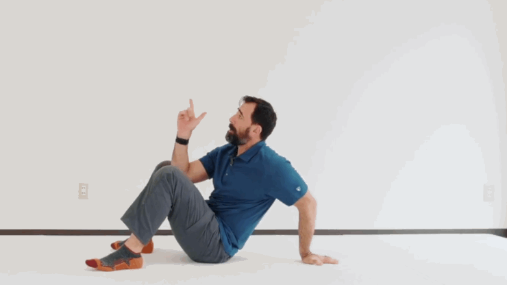 Gif of man in blue polo and gray pants demonstrating three point bridge.