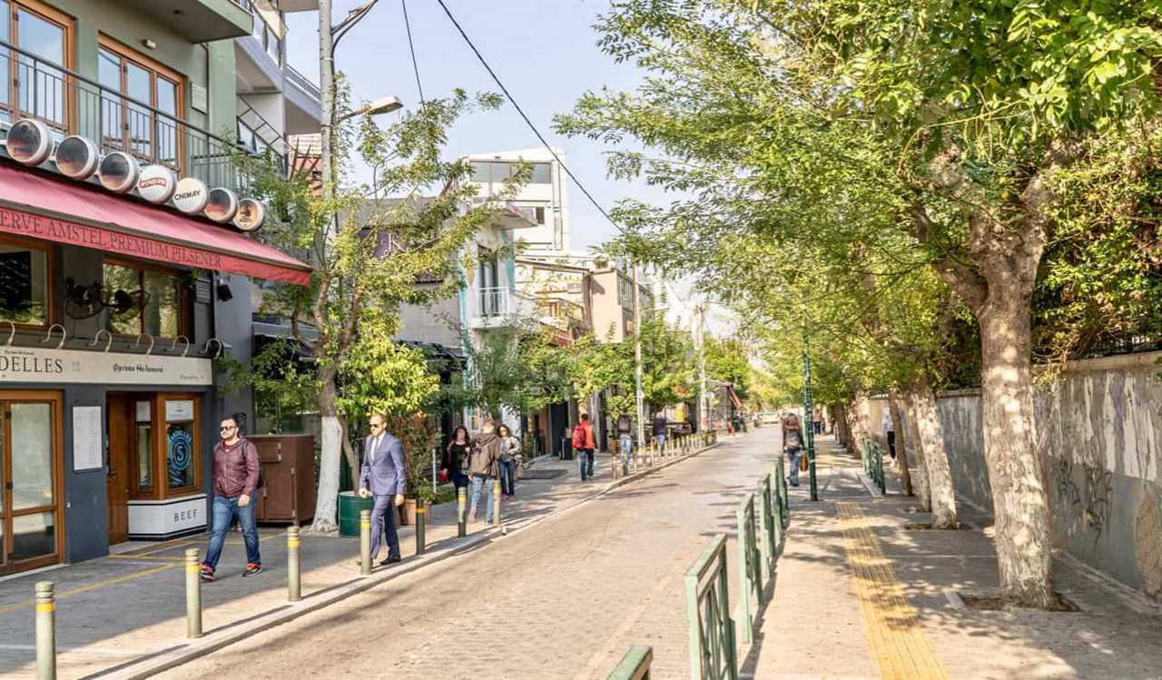 People walking down the road in the popular Gazi district in Athens, Greece during the day