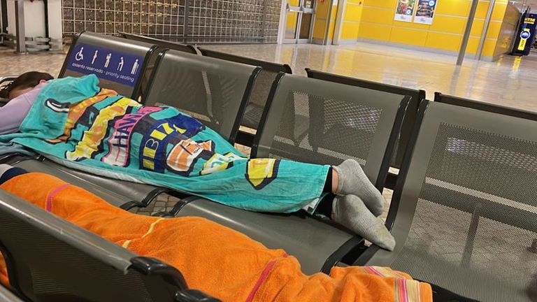 Naomi Thomas' adopted children, Alfie and Annie, sleep under towels at Faro airport. in Portugal after canceling easyJet flight to Liverpool on Saturday evening