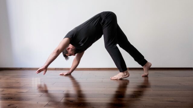 Ryan demonstrates bear crawl on hands and feet with hips piked toward ceiling.