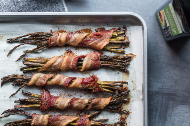 Bacon wrapped asparagus on a sheet pan