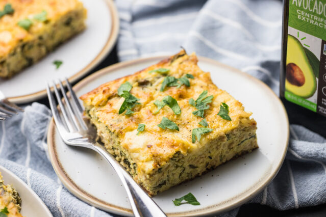 sausage and egg casserole on white plate with fork