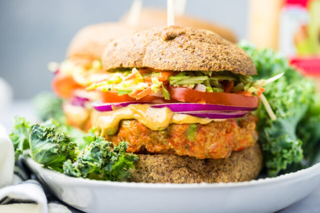 Salmon burger on white plate