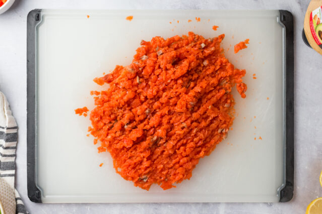 Minced salmon on a cutting board