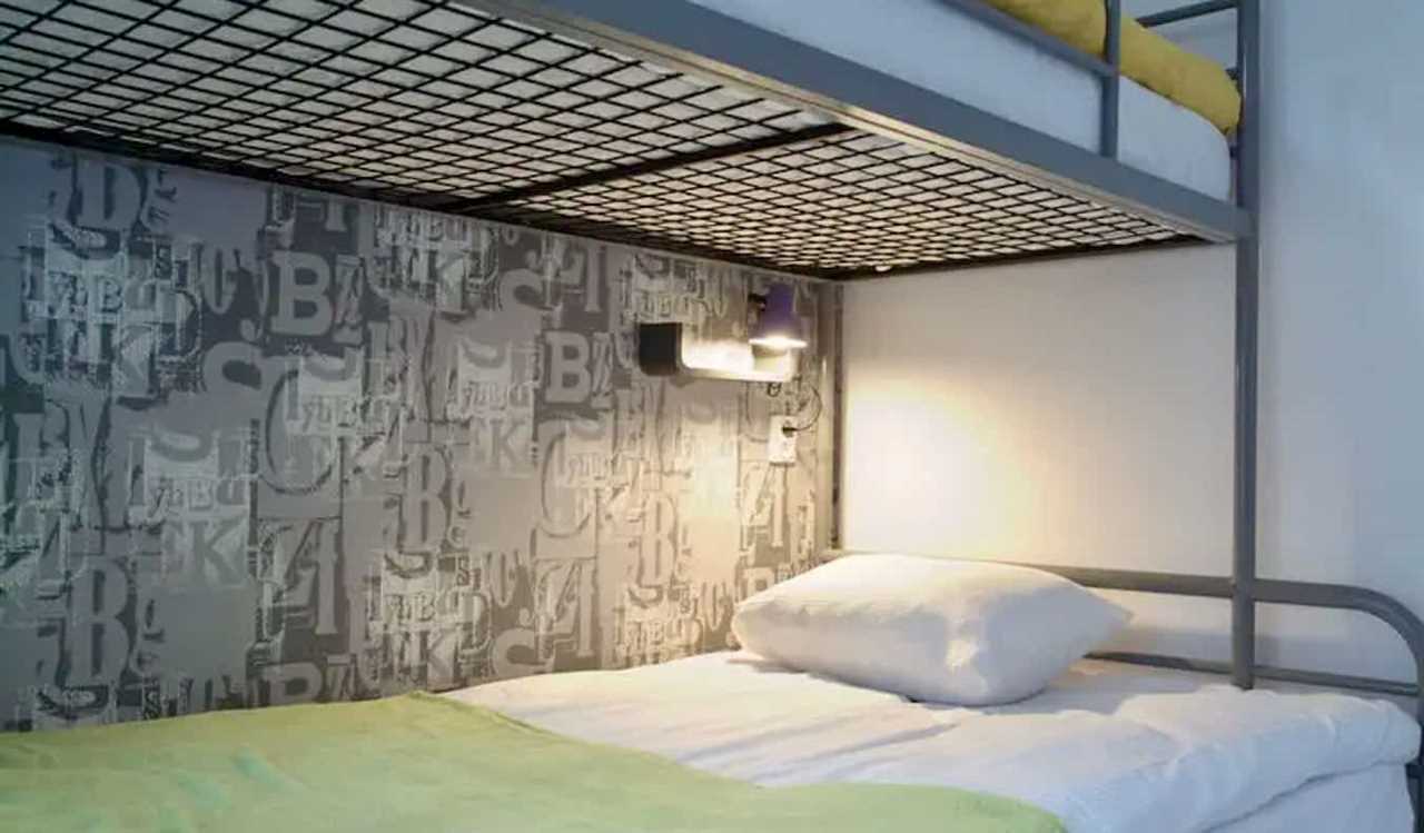 A small dorm bed in the Hostel Lwowska 11 hostel in Warsaw, Poland