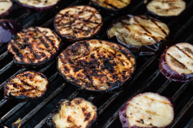 charred eggplant on a grill
