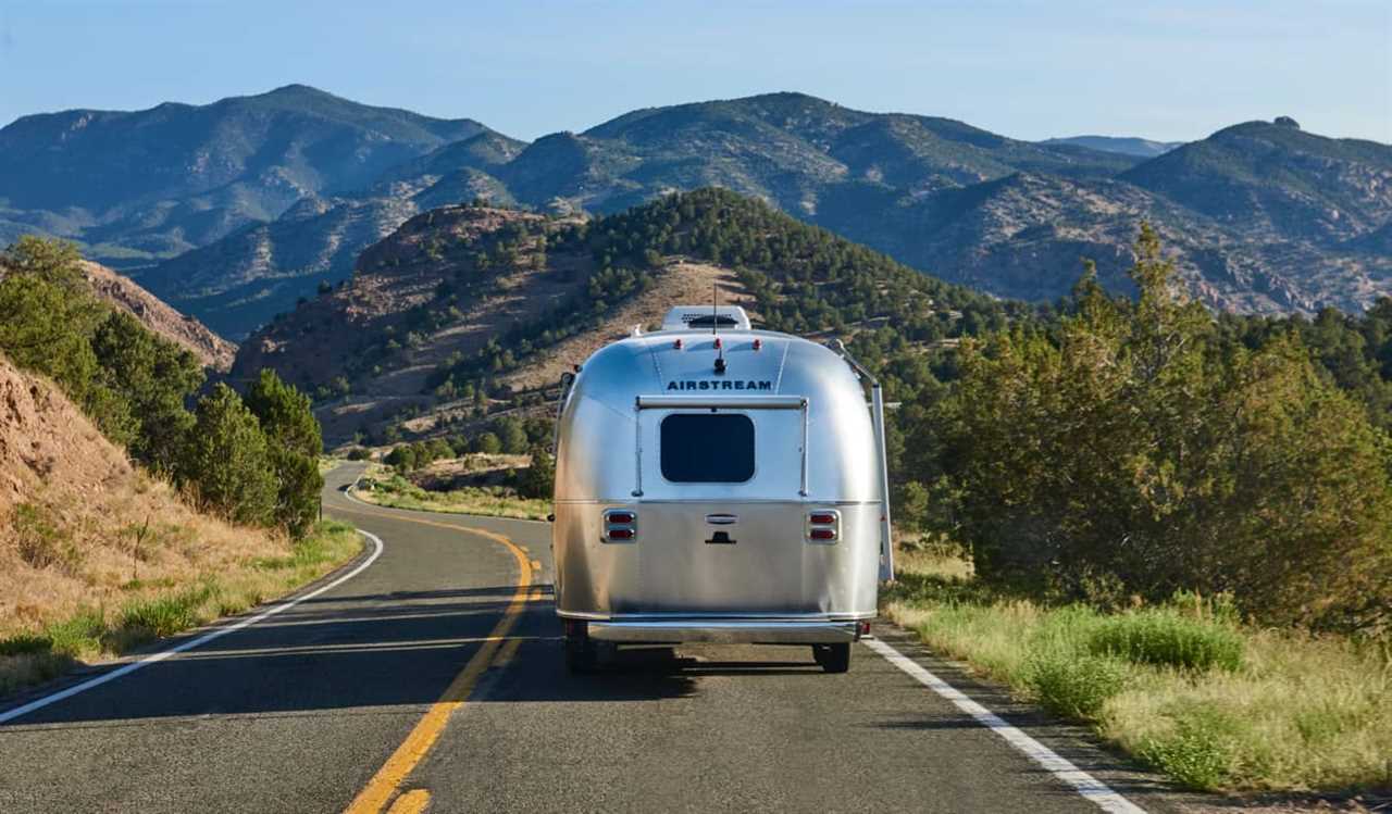 An old airstream RV crusing down the open road in the USA