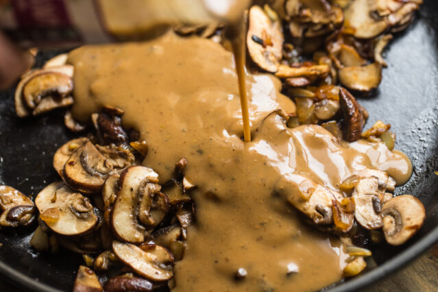 gravy and mushrooms in a skillet