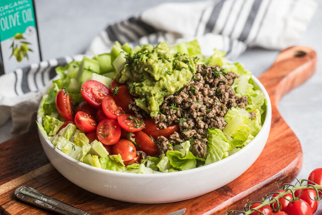 gyro taco salad with tzatziki guacamole recipe in a bowl