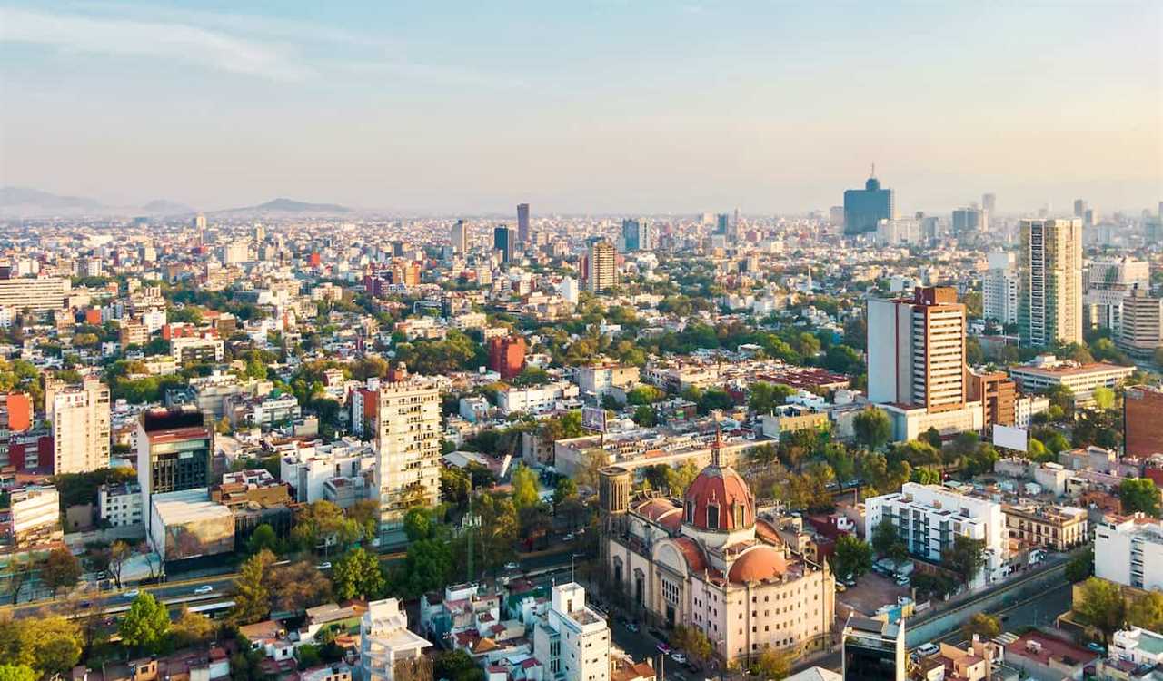 The skyline of Mexico City, Mexico and its towering skyscrapers and lush greenery