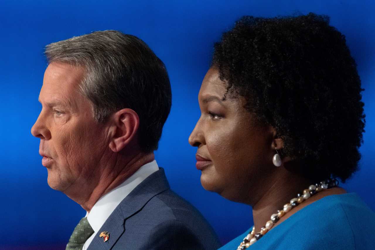 Republican Georgia Gov. Brian Kemp, left, and Democratic challenger Stacey Abrams face off in a televised debate, in Atlanta, on Oct. 30, 2022.