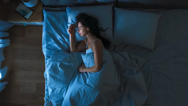 Woman getting beauty sleep at night