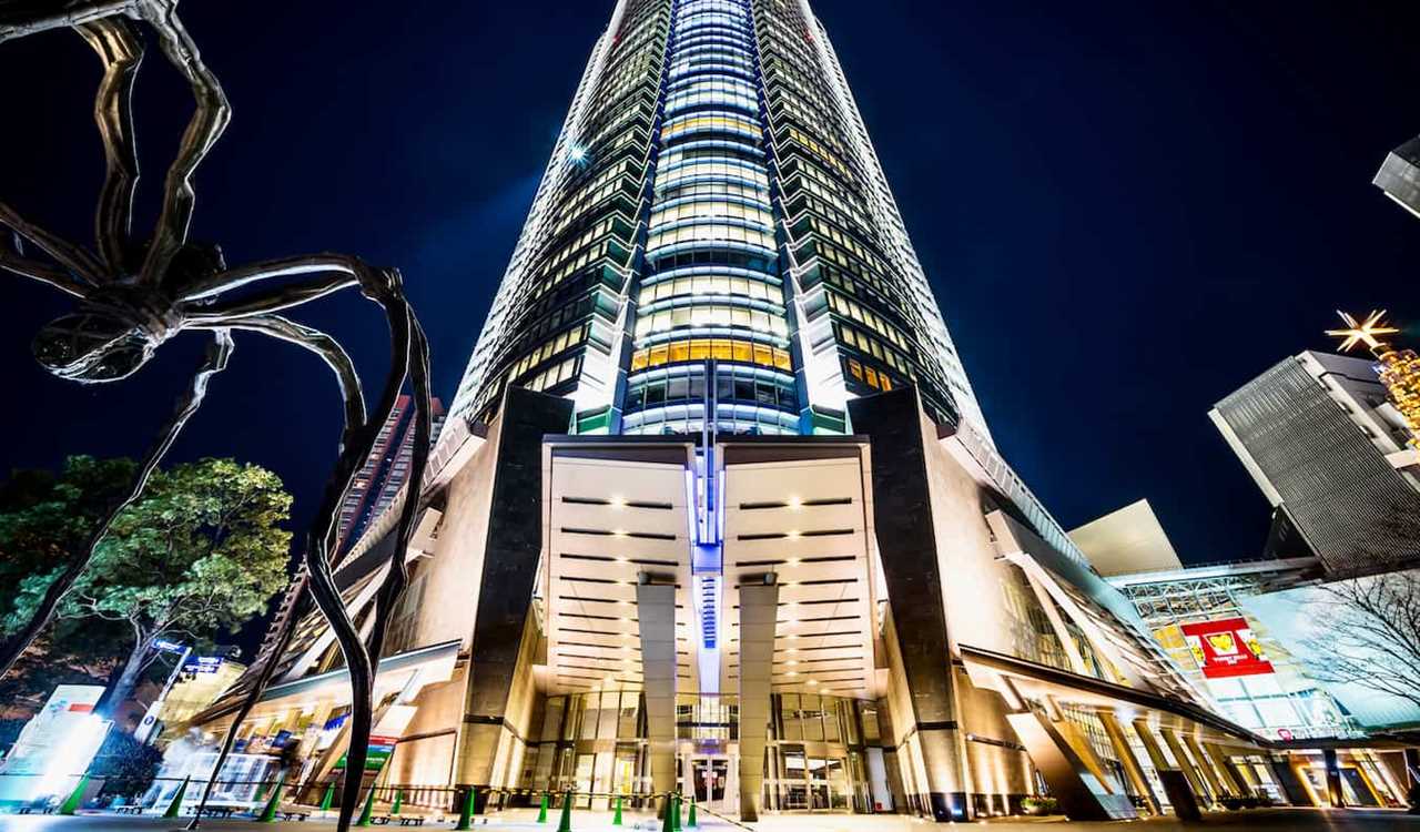A towering skyscraper in the Roppongi district of Tokyo, Japan at night