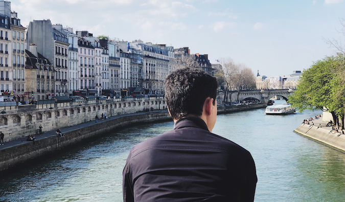 Matt Kepnes of Nomadic Matt looking over a canal in Paris