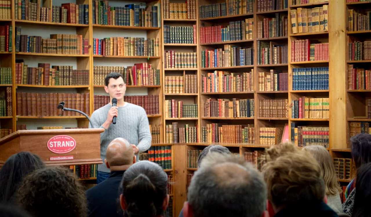 Matt Kepnes of Nomadic Matt speaking at a book store while on a book tour