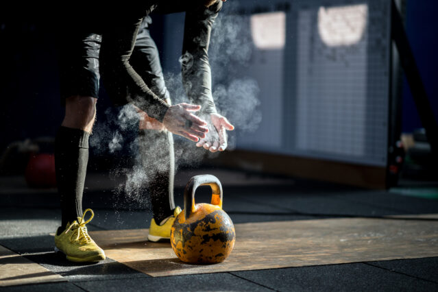 Man ready to exercise with kettle bell