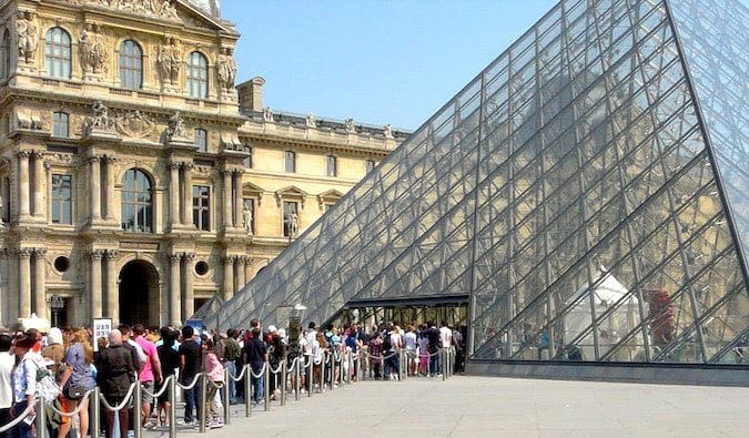 people waiting to get into the louvre museum