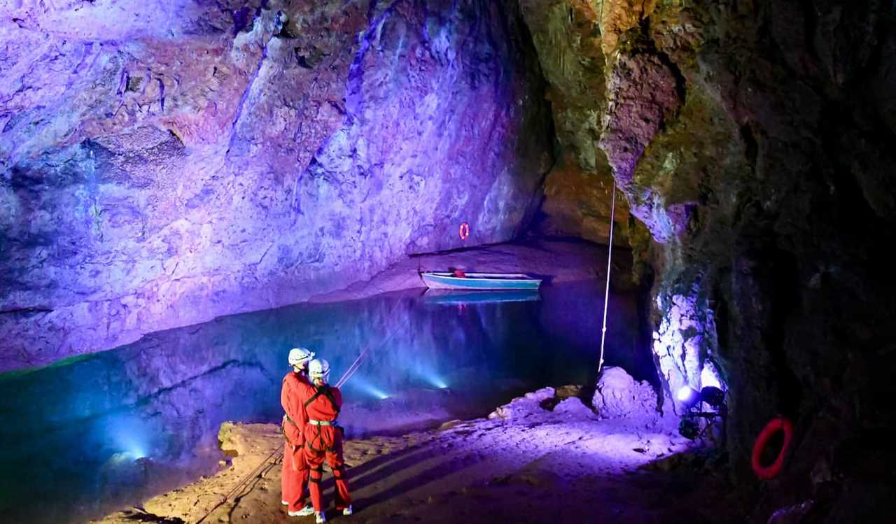 People exploring the colorful Wookey Caves near Bristol, UK