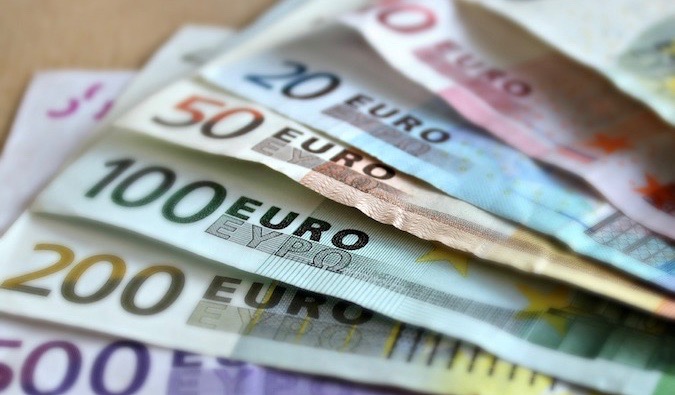 a bunch of colorful Euro bills