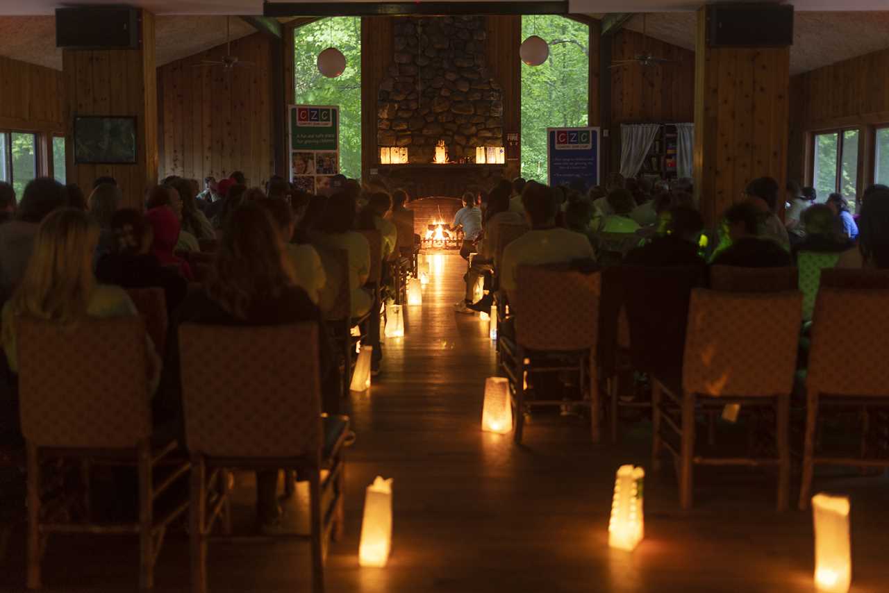 Campers, buddies, and staff gather for a memorial ceremony. 