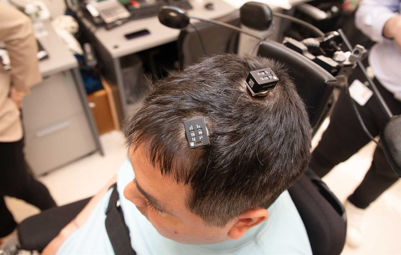 Keith Thomas, who lives with paralysis, had five tiny electrode arrays implanted in his brain in a novel technique known as double neural bypass. When connected to a computer, the chips use artificial intelligence to decode and translate his thoughts into action.