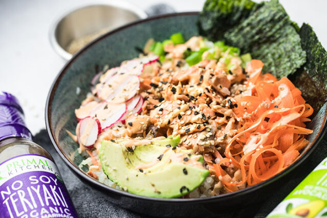 Salmon rice bowls with carrots, avocado, radishes, and Primal Kitchen Teriyaki.