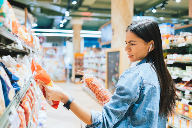 Woman stressing over food at grocery store