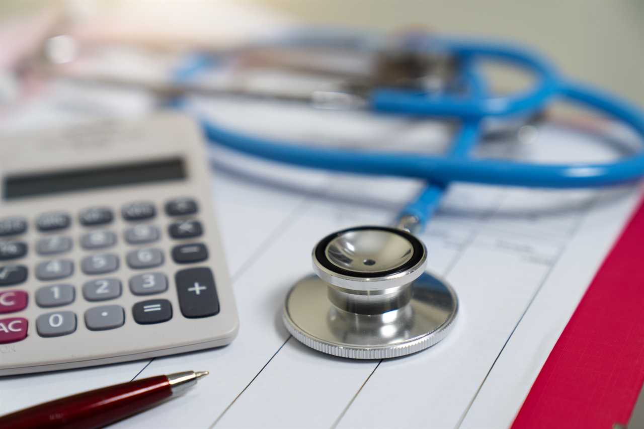 Cost of health care concept, stethoscope and calculator on document