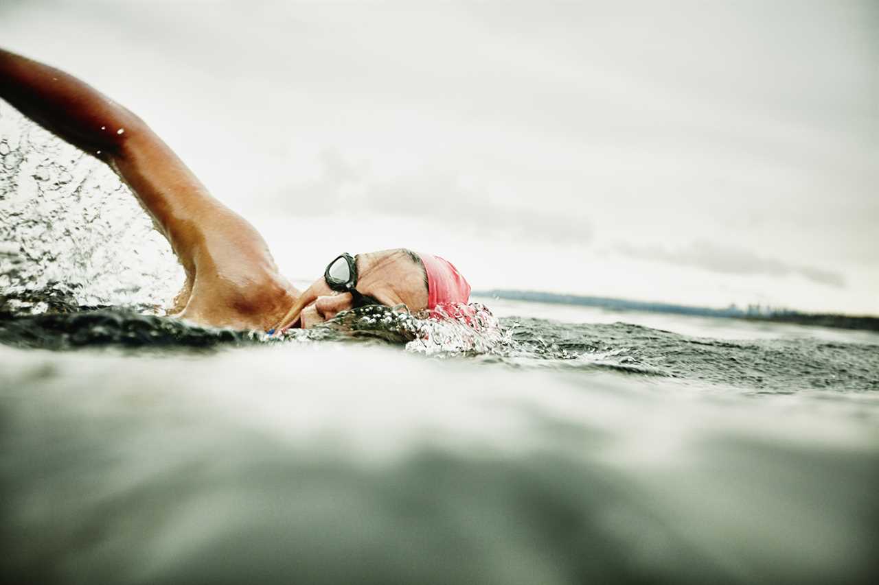 Woman taking a breath during open water swim