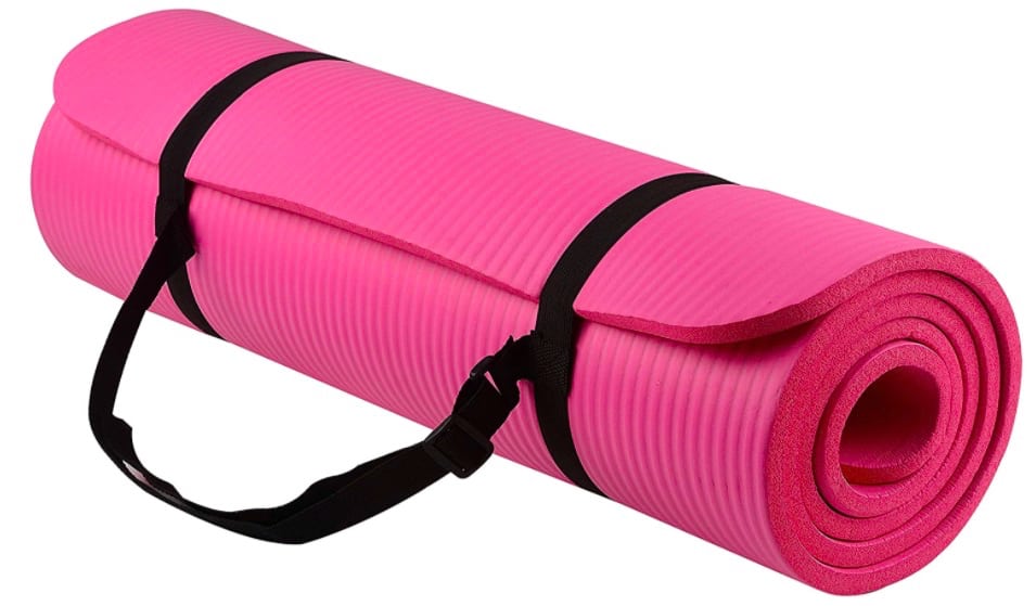 A pink yoga mat rolled up