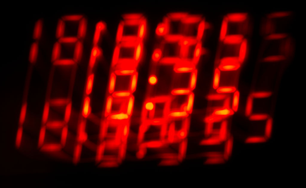 The time is seen displayed on an alarm clock display in Warsaw, Poland on Oct. 28, 2023.