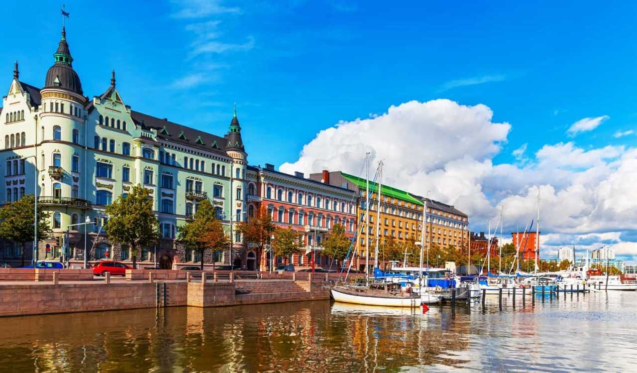 The waterfront of Helsinki, Finland, with sailboats docked and colorful buildings