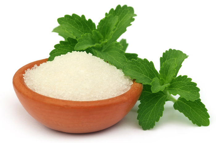 Bowl of Stevia in front of Stevia Plant | Stevia vs Sugar