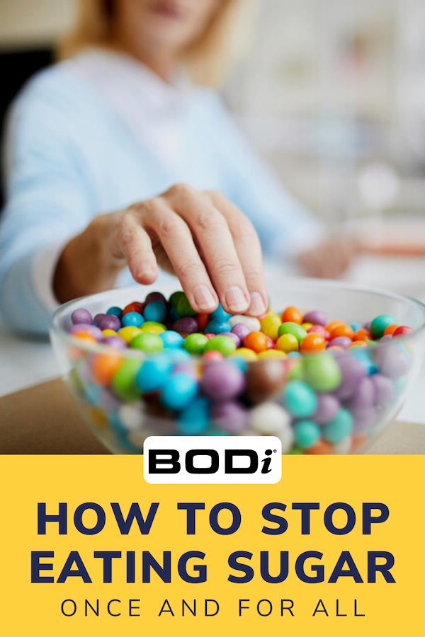 Pin Image of Woman Eating Candy in Office | How to Stop Eating Sugar