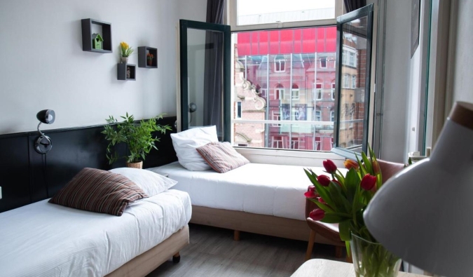 Cozy guestroom with a balcony at Max Brown Museum Square in Amsterdam, the Netherlands